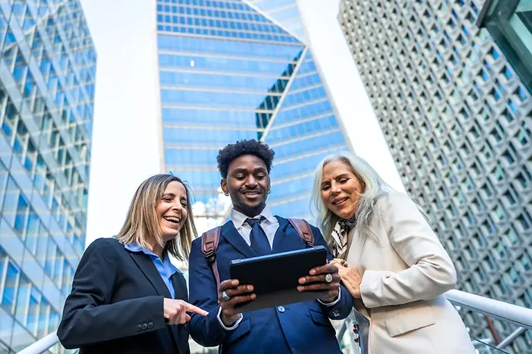 diverse-business-team-collaborating-using-tablet.webp